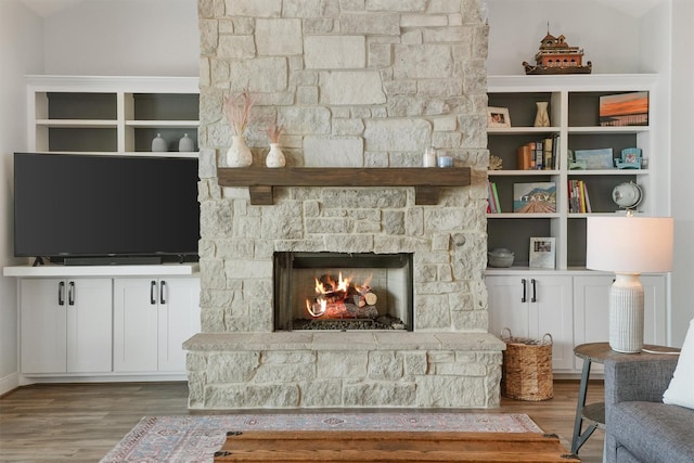 254 Peninsula Dr, Livingston, TX 77351 - living area featuring wood finished floors and a fireplace