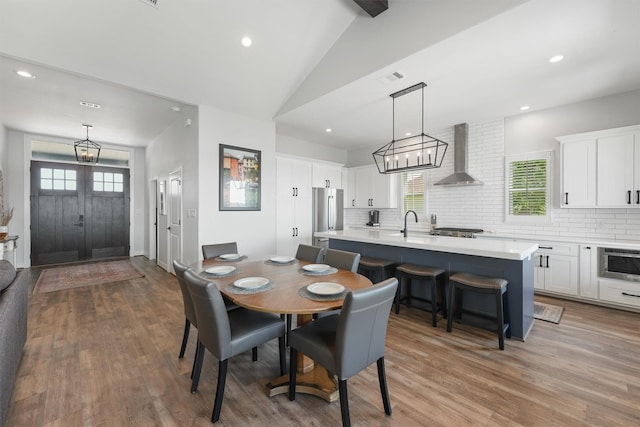 254 Peninsula Dr, Livingston, TX 77351 - dining room with a chandelier, wood finished floors, and recessed lighting