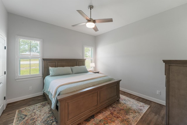 254 Peninsula Dr, Livingston, TX 77351 - bedroom with ceiling fan, baseboards, and dark wood-style flooring
