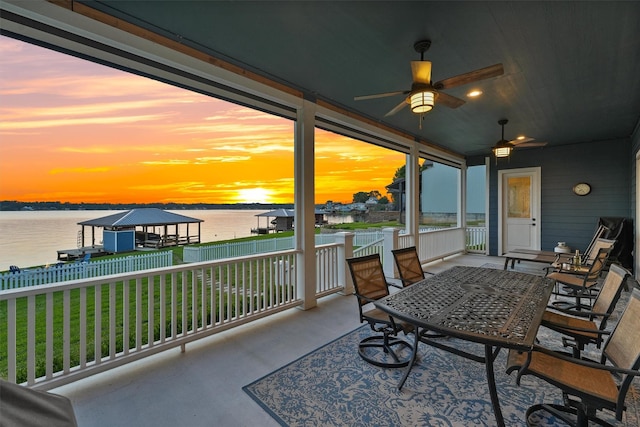 254 Peninsula Dr, Livingston, TX 77351 - sunroom with ceiling fan and a water view