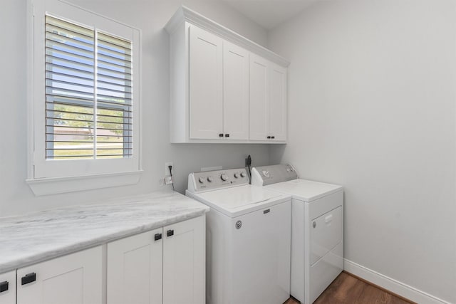 254 Peninsula Dr, Livingston, TX 77351 - washroom featuring washing machine and clothes dryer, baseboards, dark wood finished floors, and cabinet space