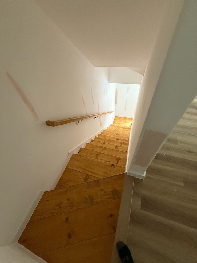 stairs with wood finished floors