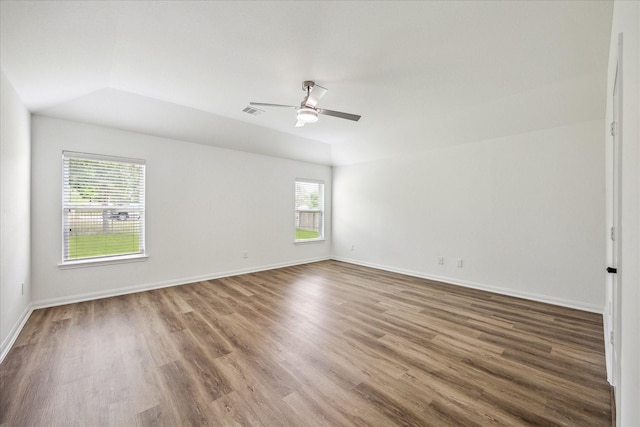 22702 Crate Falls Dr, Hockley, TX 77447 - empty room featuring baseboards, ceiling fan, wood finished floors, and lofted ceiling