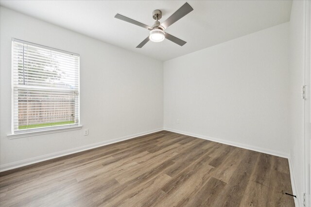 22702 Crate Falls Dr, Hockley, TX 77447 - empty room with baseboards, ceiling fan, and wood finished floors