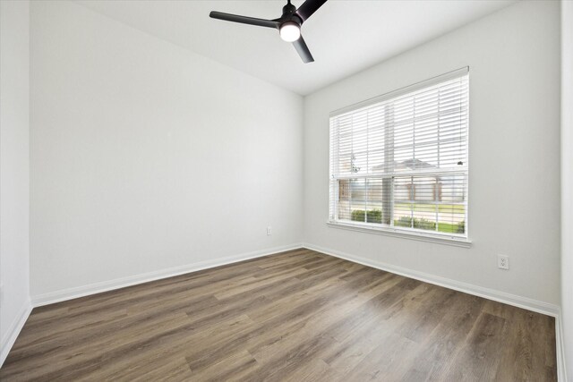 22702 Crate Falls Dr, Hockley, TX 77447 - empty room with baseboards, a ceiling fan, and wood finished floors