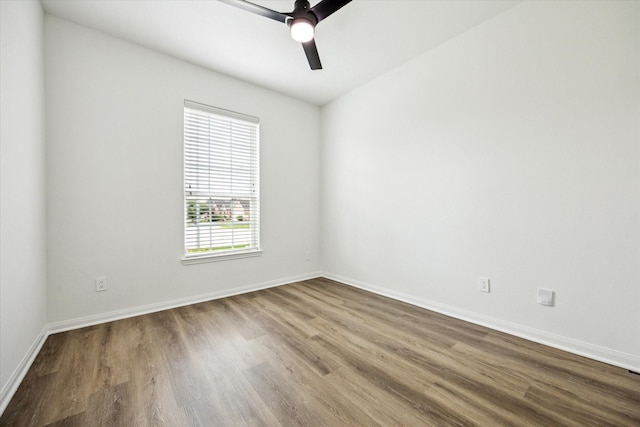 22702 Crate Falls Dr, Hockley, TX 77447 - spare room with baseboards, dark wood finished floors, and ceiling fan