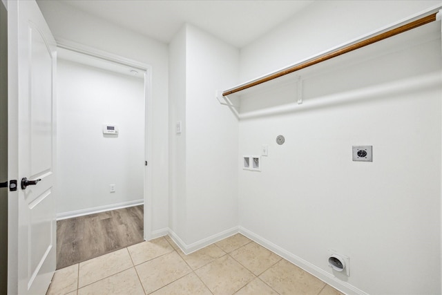 22702 Crate Falls Dr, Hockley, TX 77447 - clothes washing area featuring washer hookup, laundry area, electric dryer hookup, light tile patterned floors, and baseboards