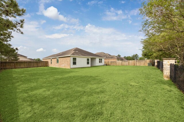 22702 Crate Falls Dr, Hockley, TX 77447 - view of yard with a fenced backyard