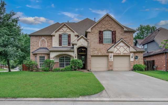 1840 Leela Springs Dr, Conroe, TX 77304 - view of front of home featuring concrete driveway, a front lawn, and an attached garage
