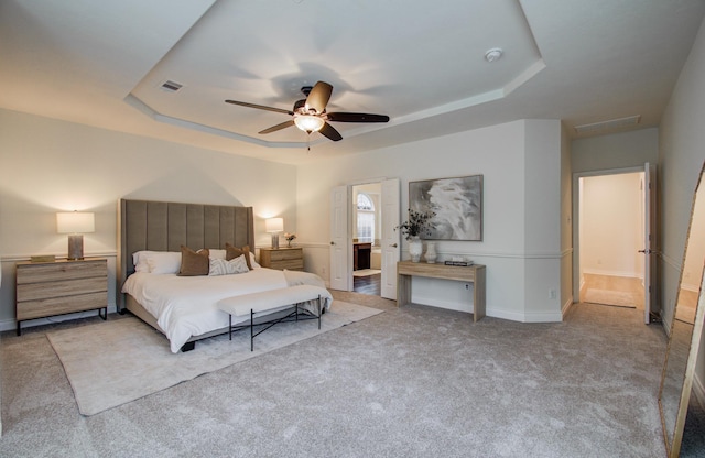 1840 Leela Springs Dr, Conroe, TX 77304 - carpeted bedroom with baseboards, a ceiling fan, visible vents, and a raised ceiling