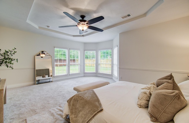 1840 Leela Springs Dr, Conroe, TX 77304 - bedroom featuring a raised ceiling, visible vents, baseboards, carpet flooring, and ceiling fan