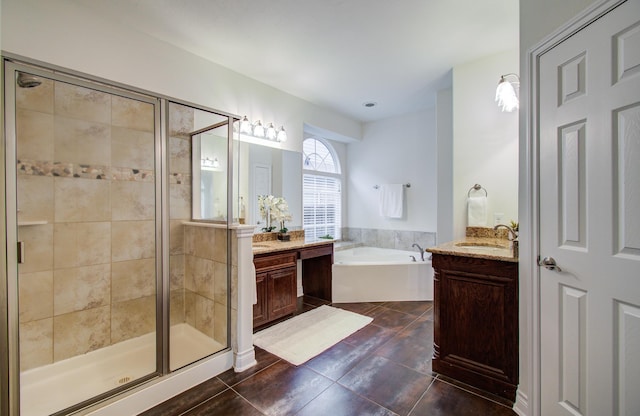 1840 Leela Springs Dr, Conroe, TX 77304 - bathroom with two vanities, a garden tub, a stall shower, and a sink