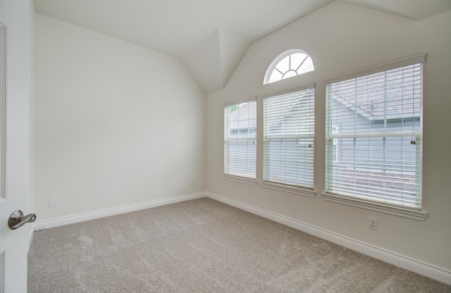 1840 Leela Springs Dr, Conroe, TX 77304 - unfurnished room with vaulted ceiling, baseboards, and carpet