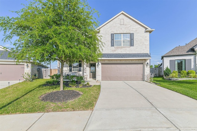 view of front of home with brick siding, an attached garage, a front yard, and fence