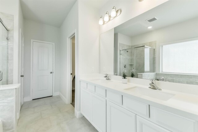 20002 Roan Ardennes Ln, Tomball, TX 77377 - full bathroom with a stall shower, double vanity, and tile patterned floors