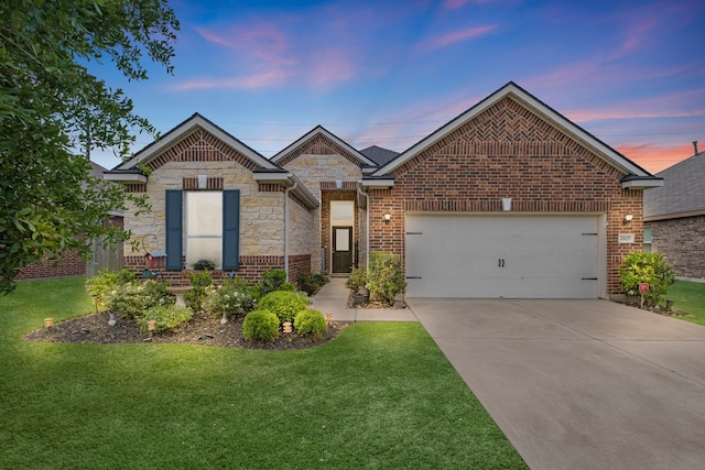 view of front of home featuring stone siding, concrete driveway, a front lawn, and a garage