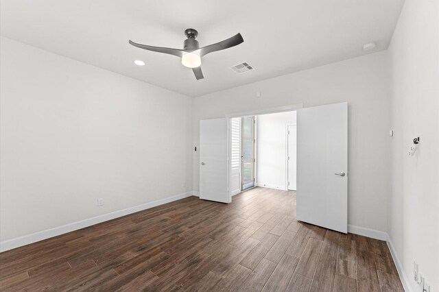 312 Eado Park Cir, Houston, TX 77020 - unfurnished room with wood finished floors, a ceiling fan, and baseboards