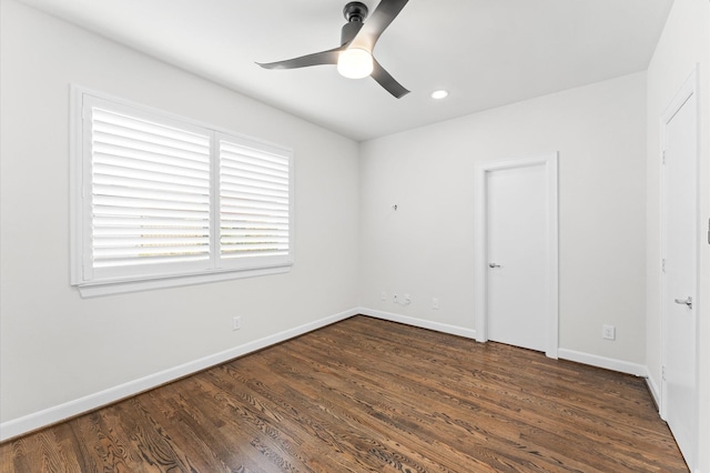 312 Eado Park Cir, Houston, TX 77020 - unfurnished bedroom featuring dark wood-type flooring, baseboards, a ceiling fan, and recessed lighting