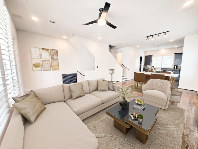 312 Eado Park Cir, Houston, TX 77020 - living room featuring wood finished floors, track lighting, stairs, and recessed lighting