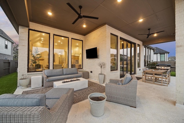 8818 Laurel Crest Dr, Missouri City, TX 77459 - view of patio / terrace featuring fence, a ceiling fan, and an outdoor living space with a fire pit