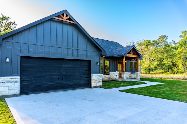 24994 Armagh St, Hempstead, TX 77445 - view of front of house featuring stone siding, board and batten siding, driveway, and a shingled roof