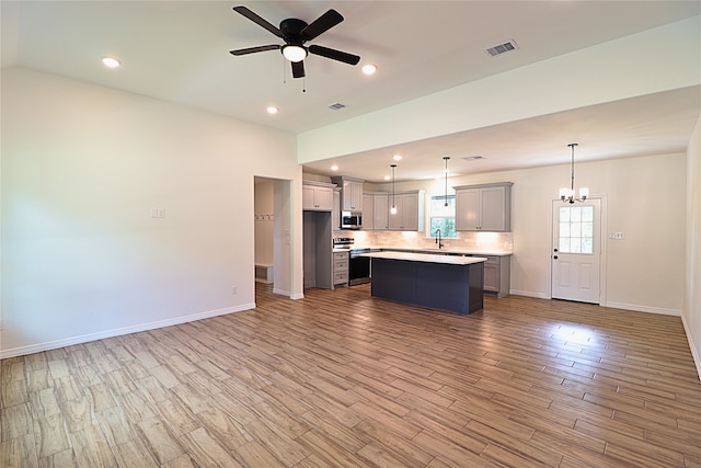 24994 Armagh St, Hempstead, TX 77445 - kitchen with stainless steel appliances, a sink, wood finished floors, light countertops, and baseboards