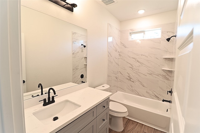 24994 Armagh St, Hempstead, TX 77445 - bathroom with vanity, toilet, washtub / shower combination, and wood finished floors