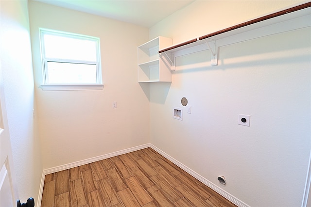 24994 Armagh St, Hempstead, TX 77445 - washroom with hookup for an electric dryer, light wood-style floors, baseboards, hookup for a washing machine, and gas dryer hookup