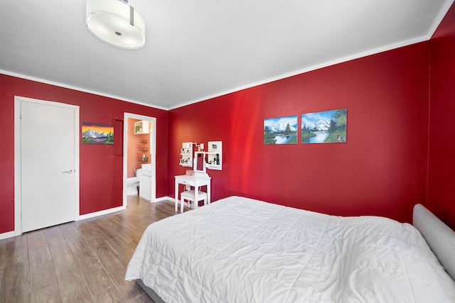 8931 Gaylord St Unit 161, Houston, TX 77024 - bedroom featuring wood finished floors, crown molding, baseboards, and connected bathroom
