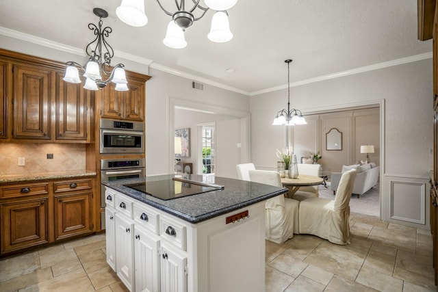 kitchen featuring crown molding, brown cabinetry, black electric stovetop, and a chandelier