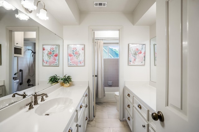 bathroom with toilet, visible vents, marble finish floor, and vanity