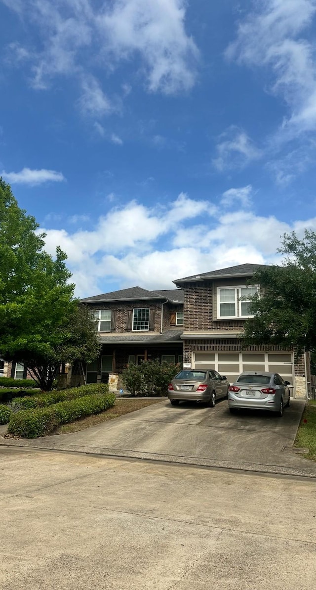 115 Shadow Springs Trl, Magnolia, TX 77354 - view of front of house featuring driveway and brick siding
