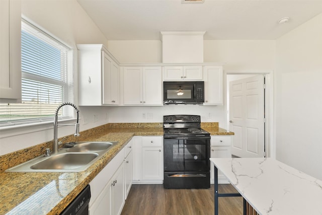 kitchen featuring black appliances, white cabinetry, a sink, and dark wood-type flooring