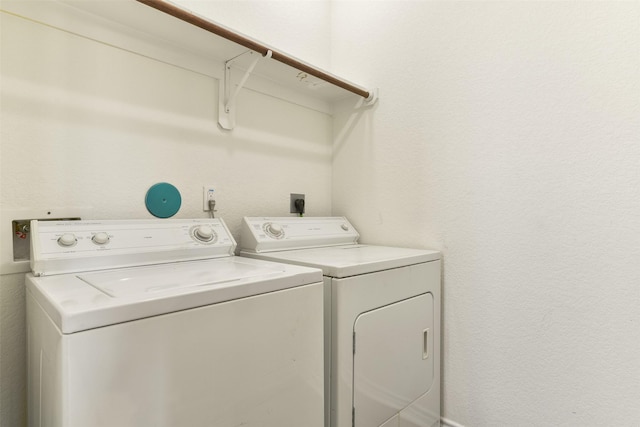 laundry area with separate washer and dryer and laundry area