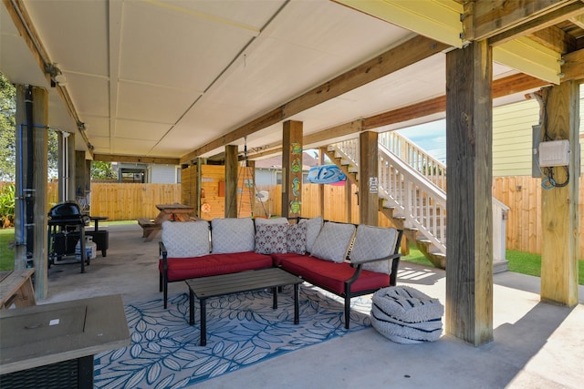 1302 55th St, Galveston, TX 77551 - view of patio / terrace with grilling area, an outdoor hangout area, stairway, and fence