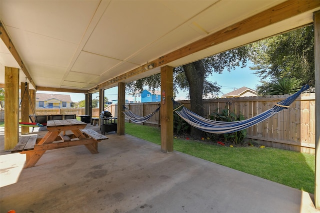 1302 55th St, Galveston, TX 77551 - view of patio with outdoor dining space and a fenced backyard