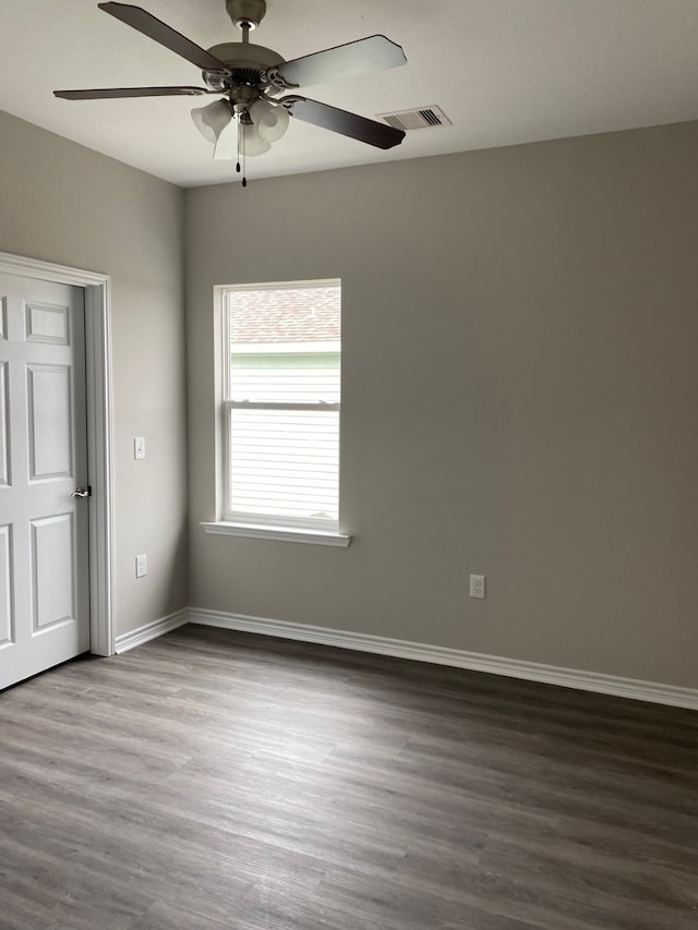 5423 Avenue N 1/2 Ave N Unit 1/2, Galveston, TX 77551 - unfurnished room featuring baseboards, visible vents, dark wood-type flooring, and ceiling fan