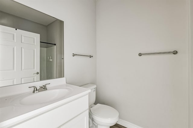 2811 Winnie St, Galveston, TX 77550 - bathroom with baseboards, vanity, a shower, and toilet