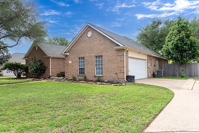 6249 Mallard Dr, Katy, TX 77493 - view of front of house featuring central AC unit, fence, concrete driveway, brick siding, and a garage