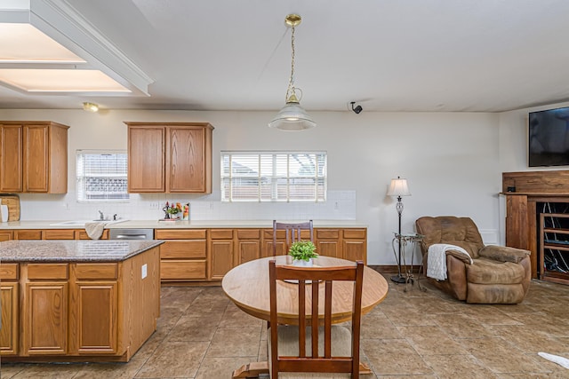 6249 Mallard Dr, Katy, TX 77493 - kitchen featuring a sink, tasteful backsplash, open floor plan, dishwasher, and decorative light fixtures