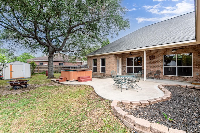 6249 Mallard Dr, Katy, TX 77493 - view of yard featuring fence, ceiling fan, a patio, an outdoor fire pit, and a hot tub