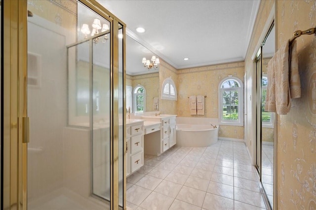full bathroom with an inviting chandelier, a shower stall, vanity, a garden tub, and ornamental molding