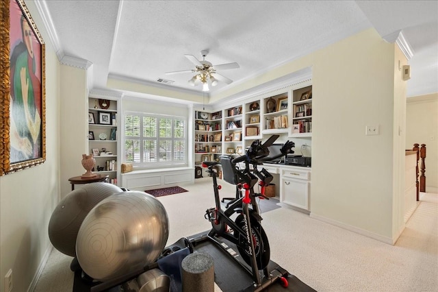 exercise area featuring light colored carpet, visible vents, ceiling fan, and a textured ceiling