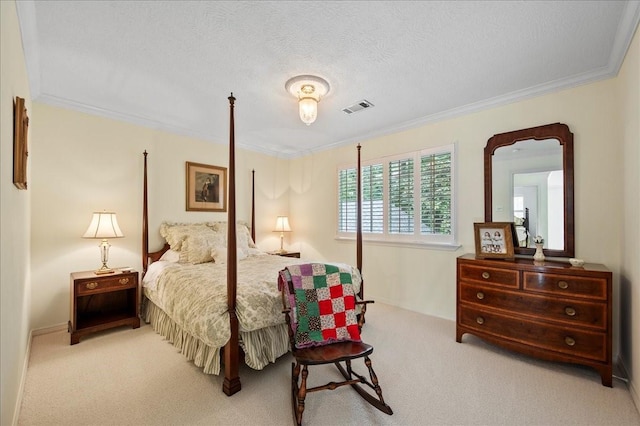 carpeted bedroom with visible vents, a textured ceiling, and crown molding