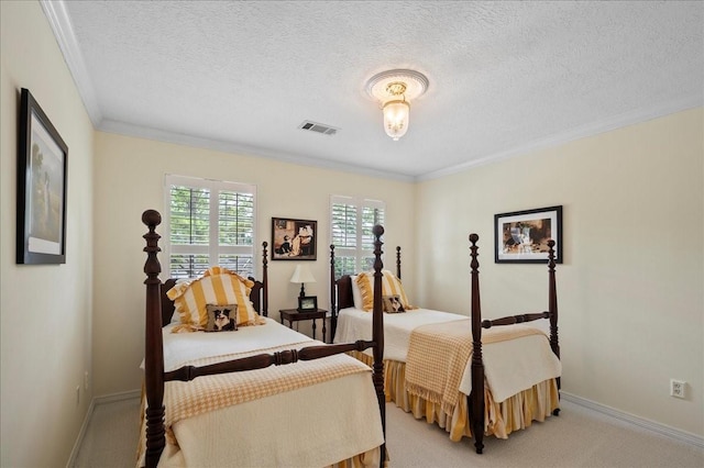 bedroom featuring baseboards, visible vents, light carpet, and a textured ceiling