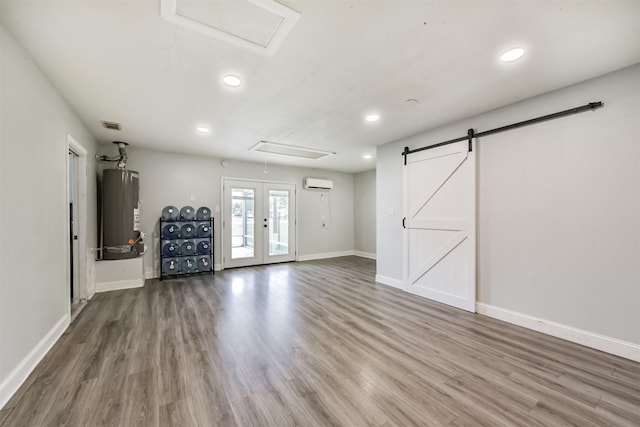 3626 Lake Breeze Ln, Crosby, TX 77532 - basement featuring water heater, wood finished floors, baseboards, and recessed lighting