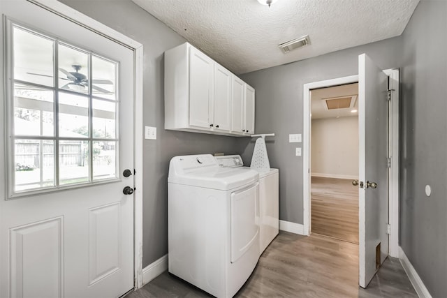 3626 Lake Breeze Ln, Crosby, TX 77532 - clothes washing area featuring cabinet space, visible vents, baseboards, washer and dryer, and attic access