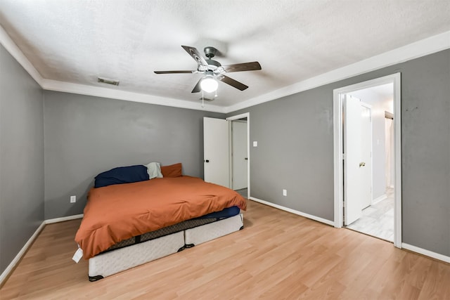 3626 Lake Breeze Ln, Crosby, TX 77532 - bedroom with wood finished floors, visible vents, and baseboards