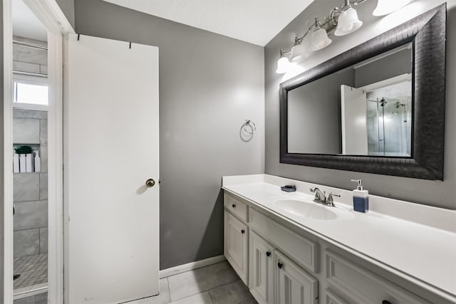 3626 Lake Breeze Ln, Crosby, TX 77532 - full bathroom with baseboards, vanity, tile patterned floors, and tiled shower