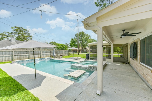 3626 Lake Breeze Ln, Crosby, TX 77532 - view of swimming pool featuring a pool with connected hot tub, a ceiling fan, a patio area, and a fenced backyard